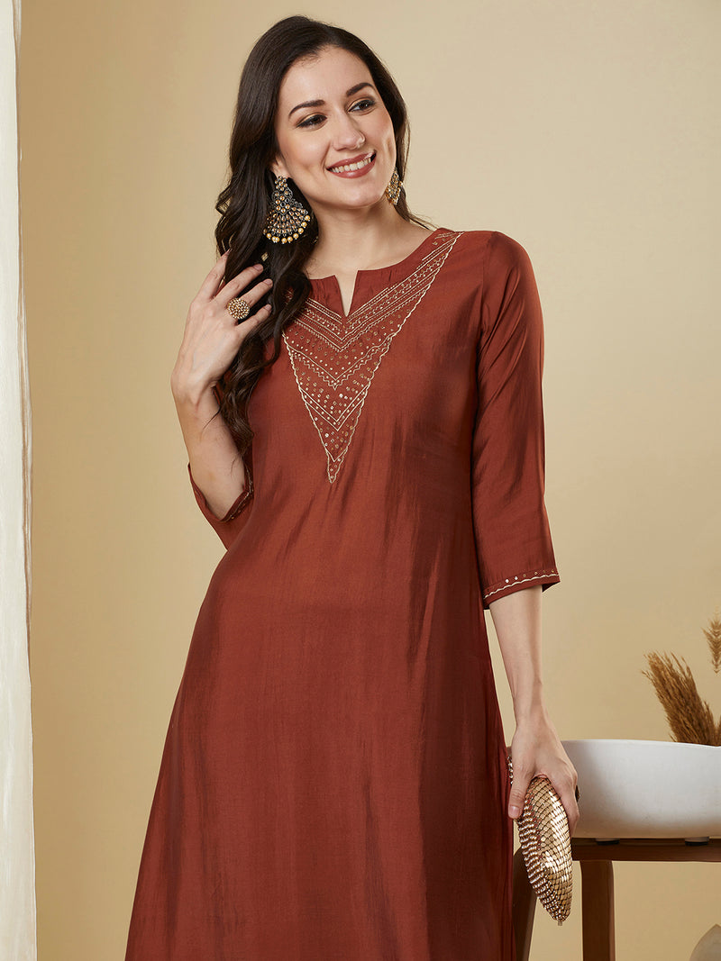 Roman silk kurta set with a triangle yoke adorned with sequins and zari work