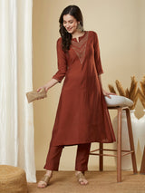 Roman silk kurta set with a triangle yoke adorned with sequins and zari work