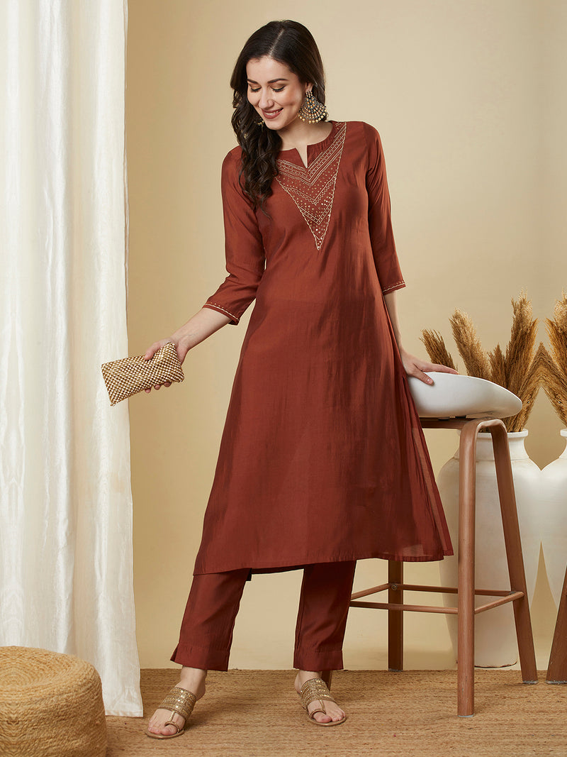 Roman silk kurta set with a triangle yoke adorned with sequins and zari work