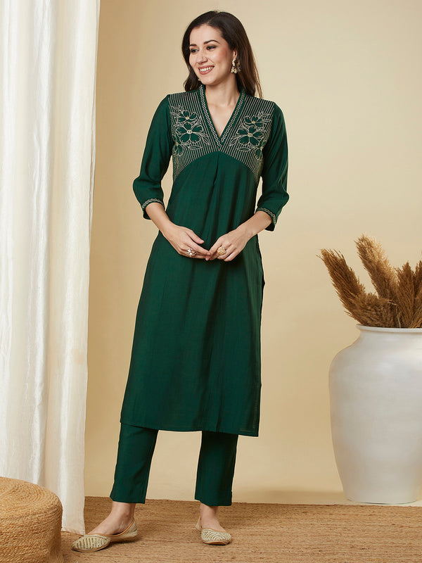 Straight alia cut kurta set with embroidered yoke and border.