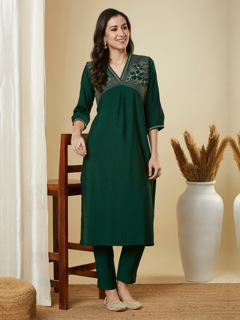 Straight alia cut kurta set with embroidered yoke and border.