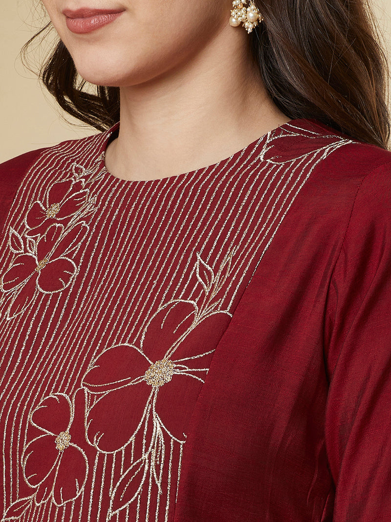 A-line shoulder princess kurta set with embroidered yoke and stitch line sleeves.