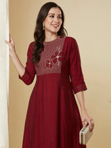 A-line shoulder princess kurta set with embroidered yoke and stitch line sleeves.