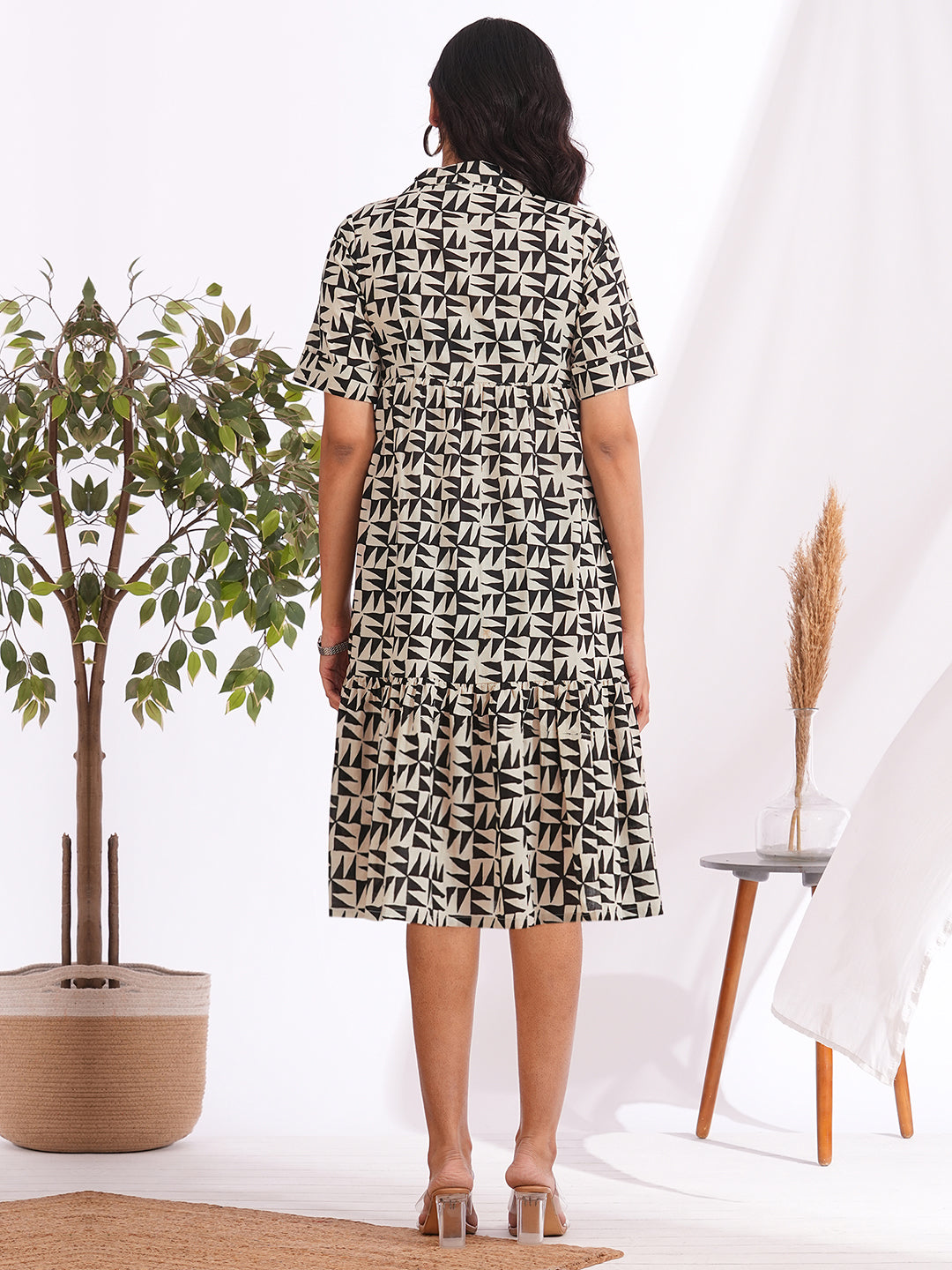 Pocketed cotton print tiered dress with a notched collar and an elbow length sleeve