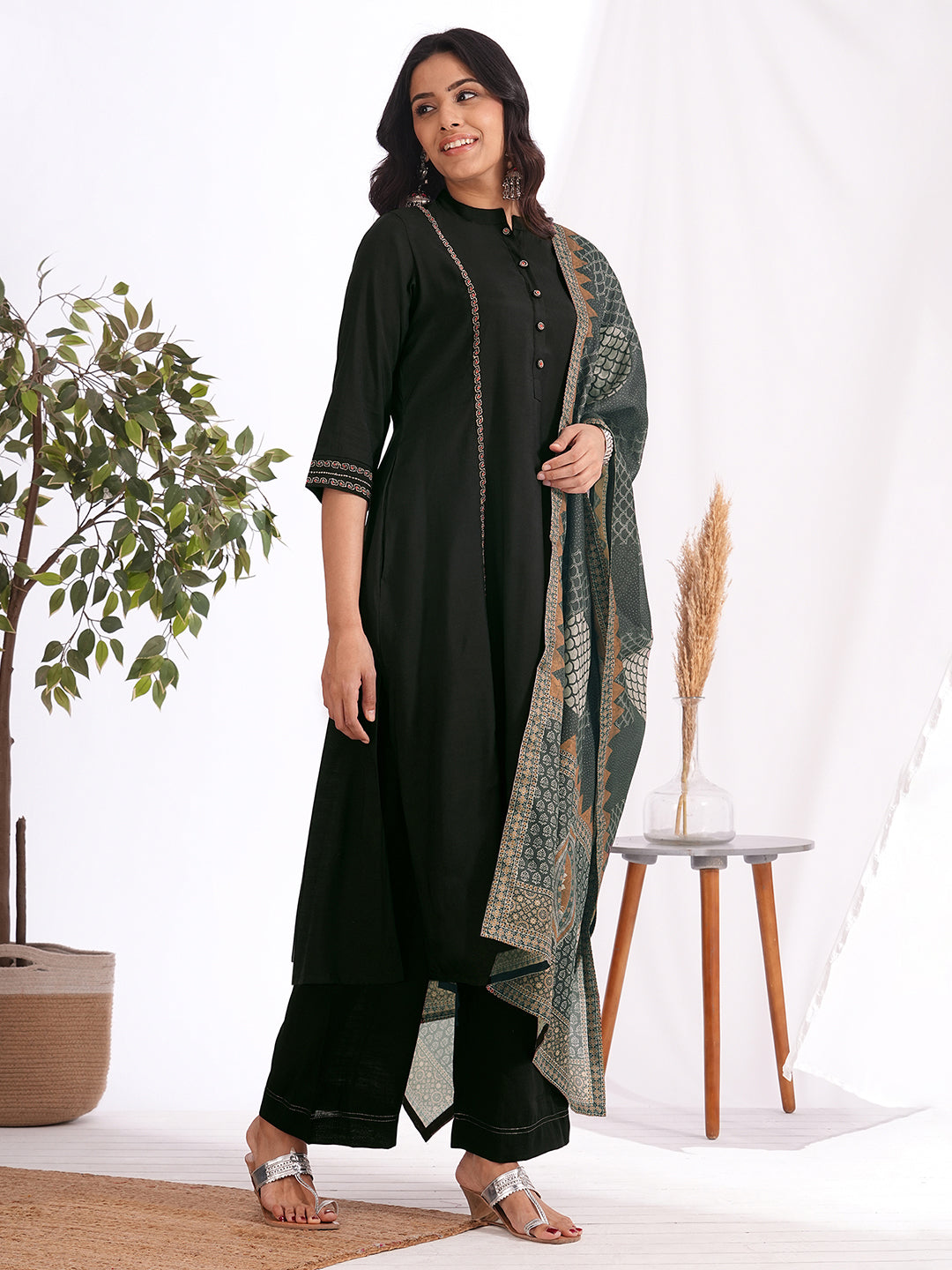 A-Line embroidered silk blend three piece set with an printed dupatta and lined palazzo.
