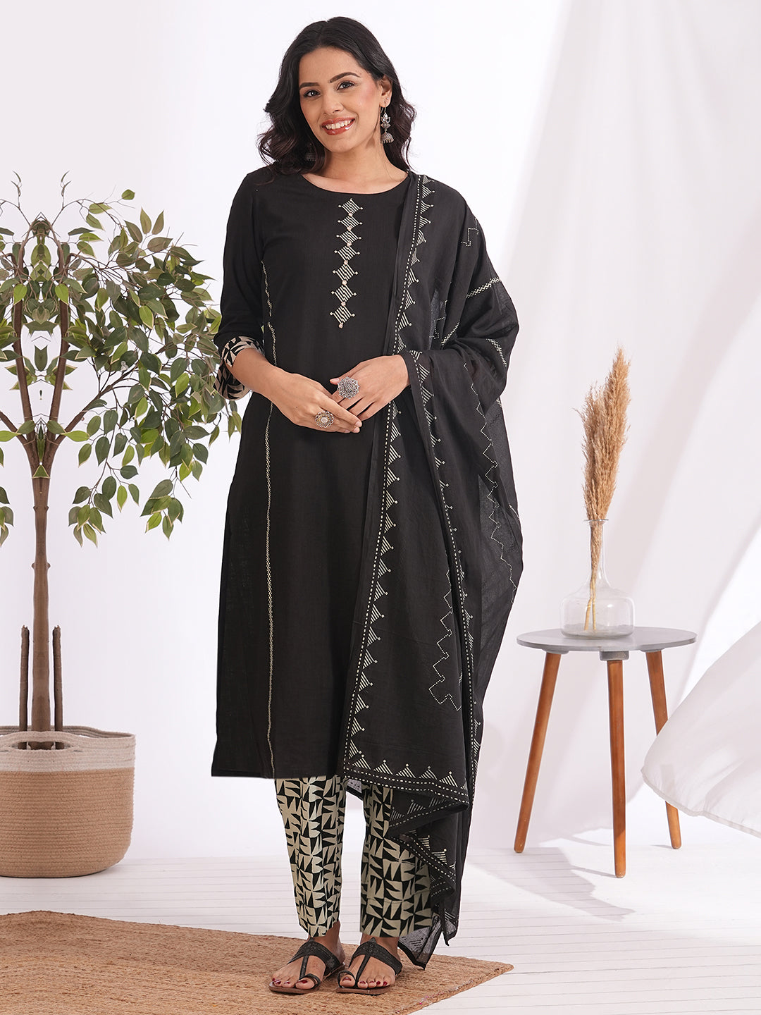 Straight fit suit set features a cotton block printed top adorned with a printed bottom & printed dupatta.