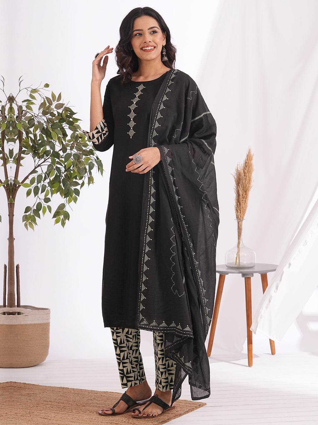 Straight fit suit set features a cotton block printed top adorned with a printed bottom & printed dupatta.