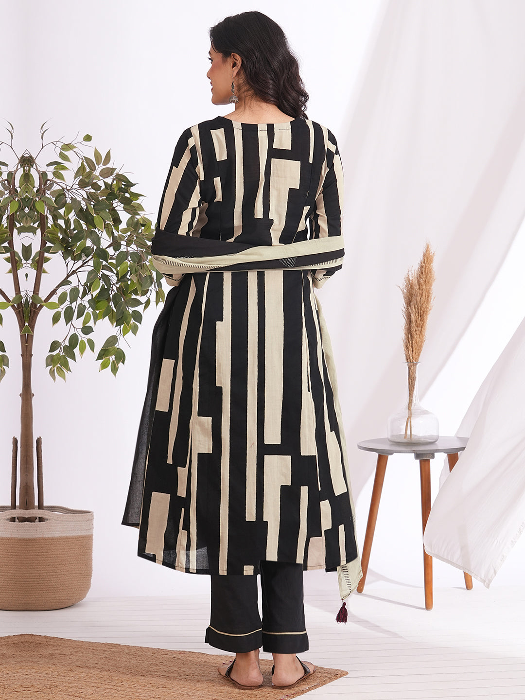 A-line printed suit set paired with a solid bottom and block printed mal dupatta.