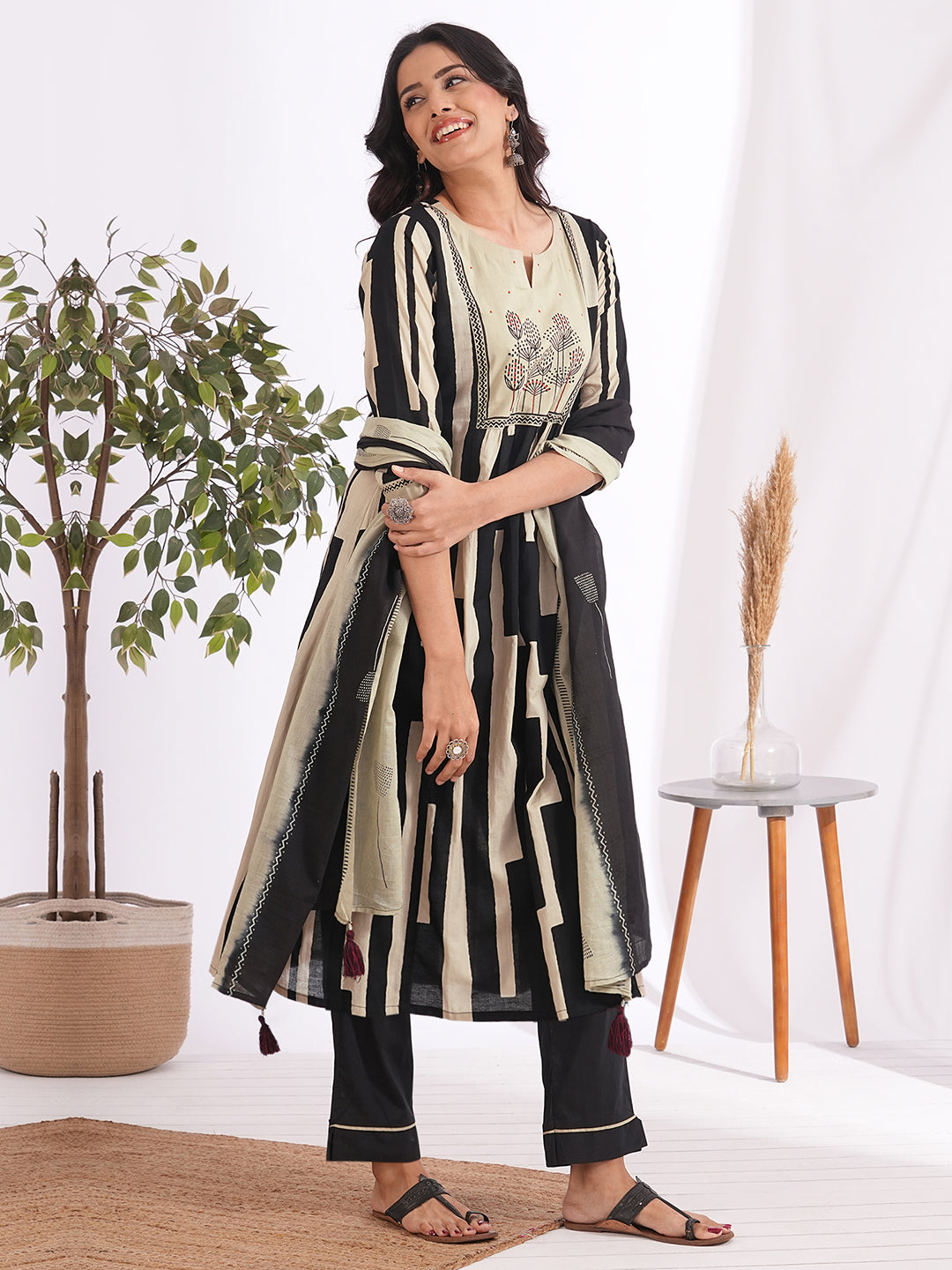 A-line printed suit set paired with a solid bottom and block printed mal dupatta.