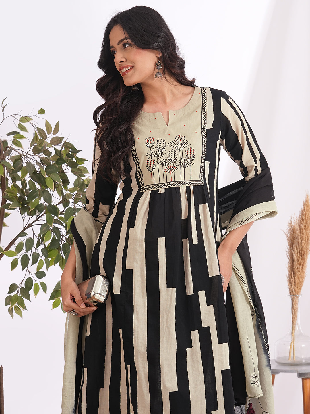 A-line printed suit set paired with a solid bottom and block printed mal dupatta.