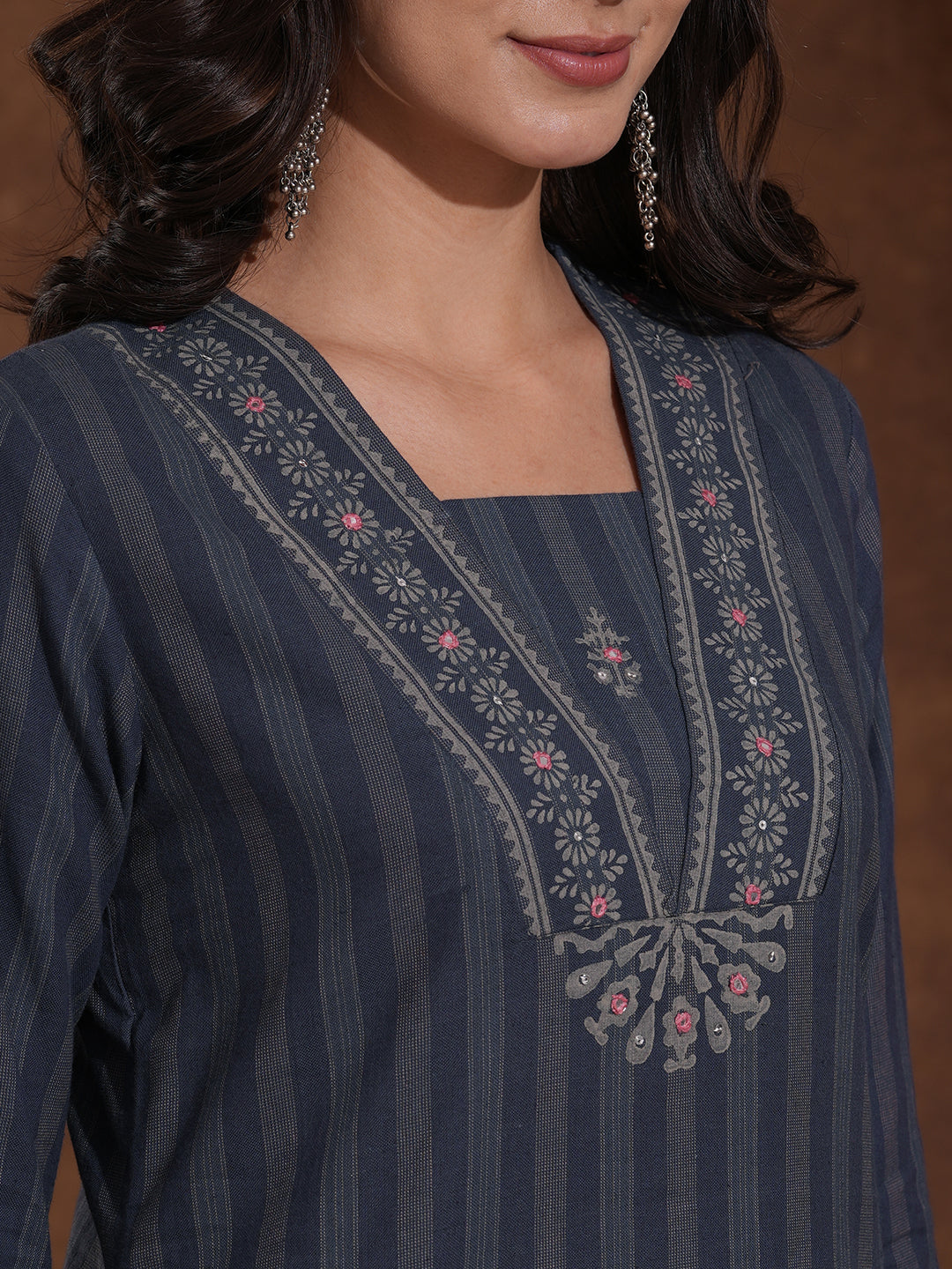 Straight fit kurta with mirror work paired with solid pant and printed dupatta.