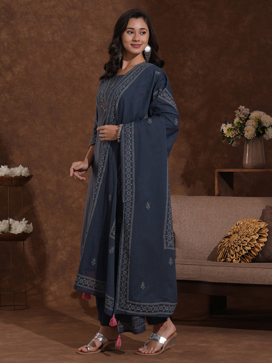 Straight fit kurta with mirror work paired with solid pant and printed dupatta.