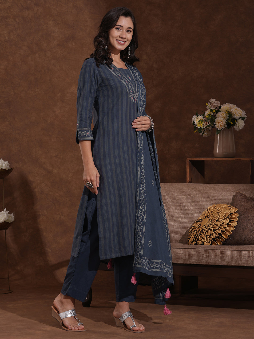 Straight fit kurta with mirror work paired with solid pant and printed dupatta.
