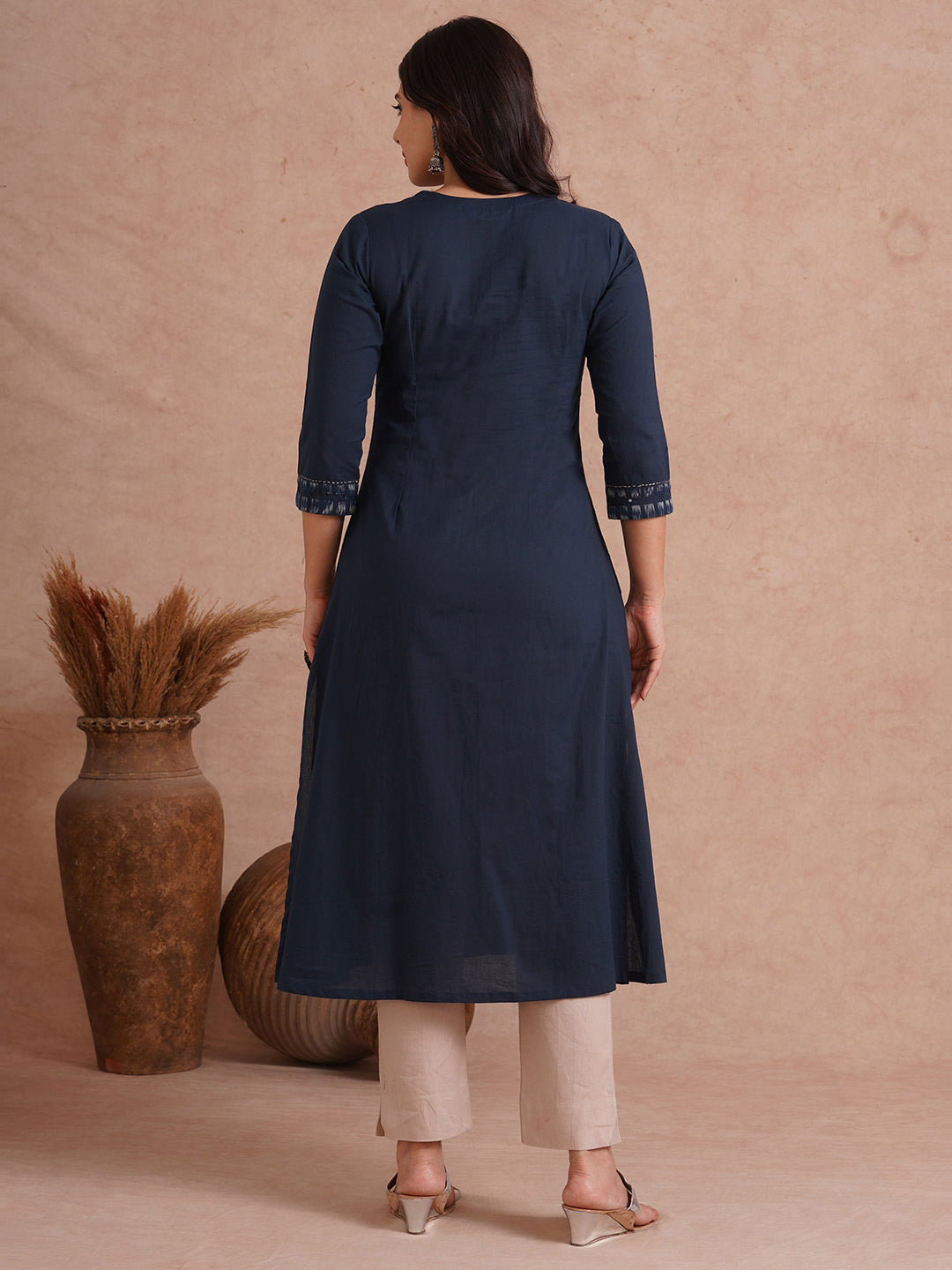 Pocketed A-Line cotton kurta with traditional 'chatakla' embroidery and mirror work.