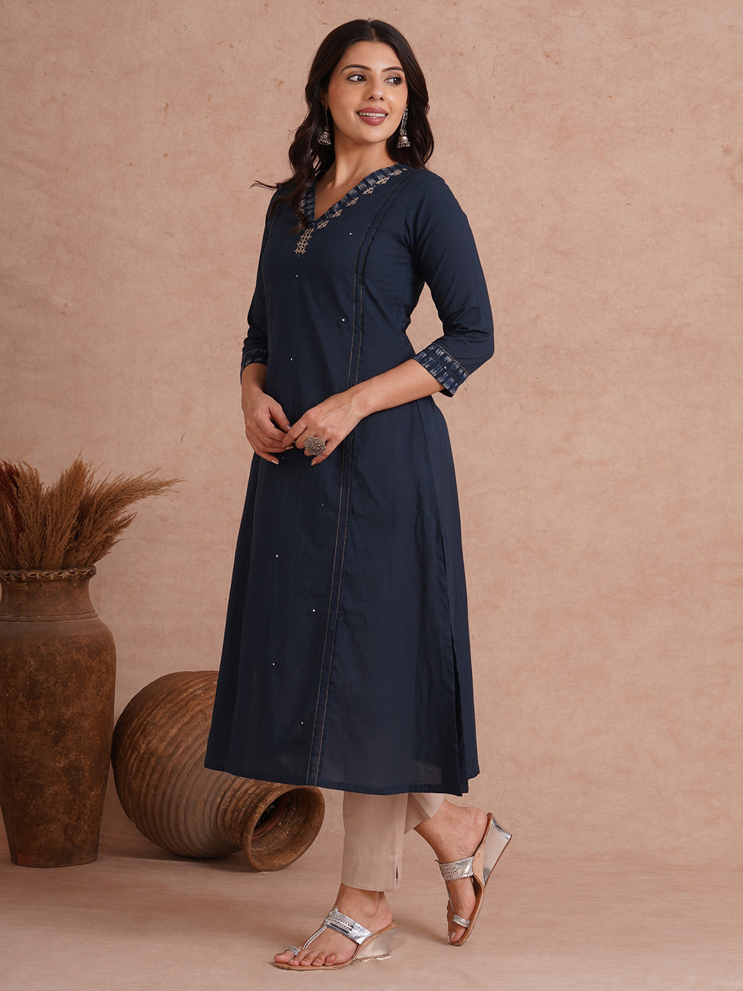 Pocketed A-Line cotton kurta with traditional 'chatakla' embroidery and mirror work.