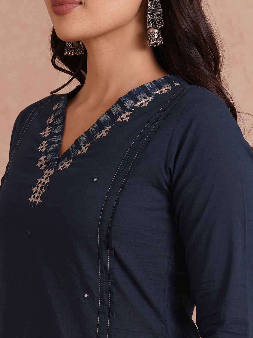 Pocketed A-Line cotton kurta with traditional 'chatakla' embroidery and mirror work.