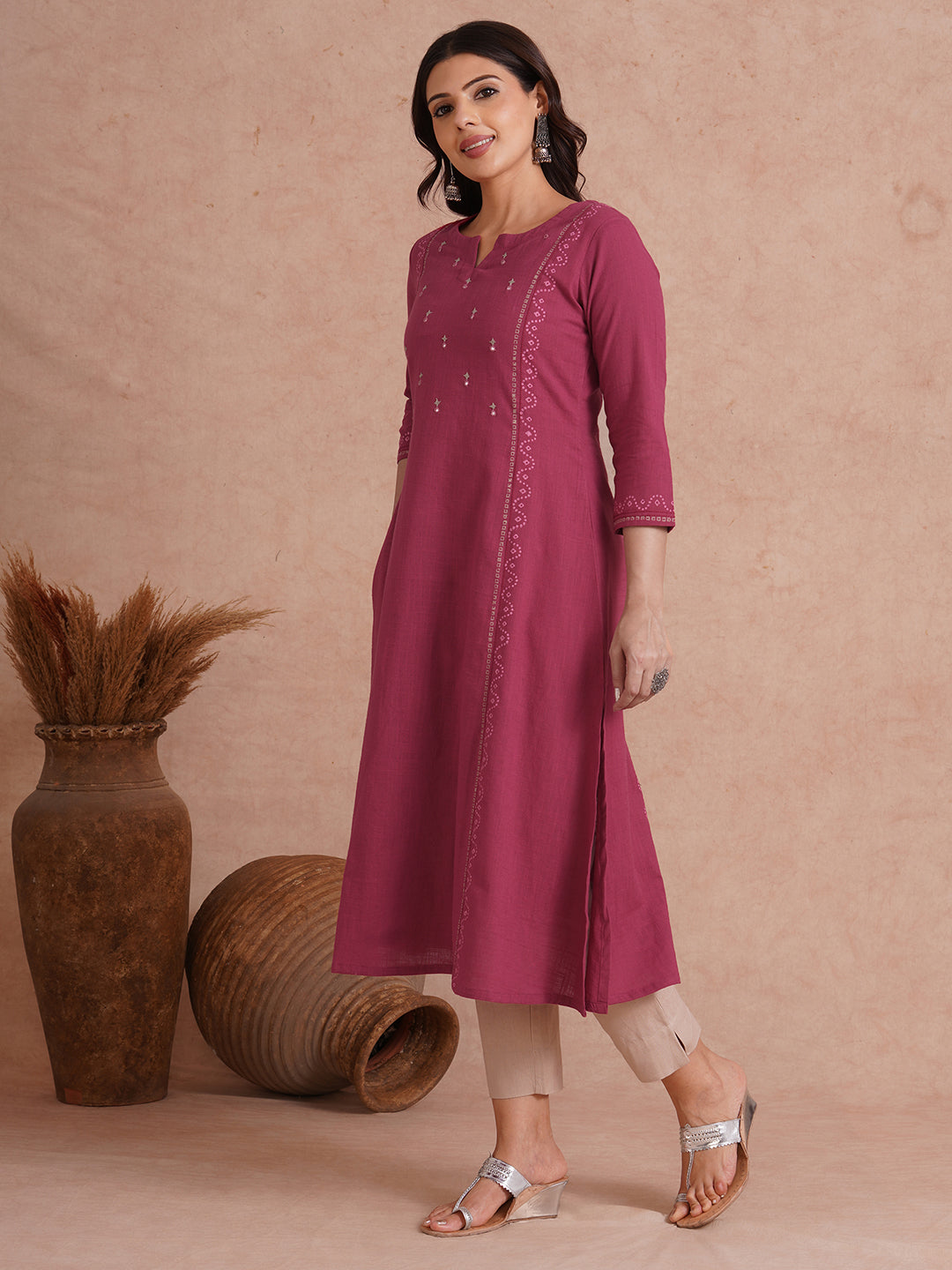 A-Line fit cotton slurb kurta with hand embroidery, block print and an inseam pocket.