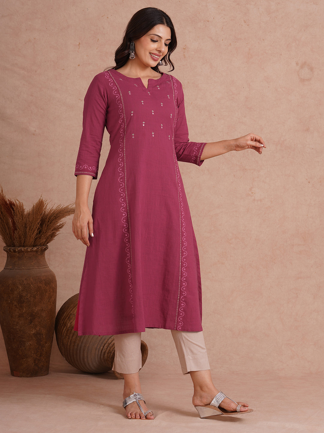 A-Line fit cotton slurb kurta with hand embroidery, block print and an inseam pocket.