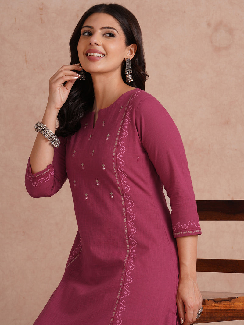 A-Line fit cotton slurb kurta with hand embroidery, block print and an inseam pocket.
