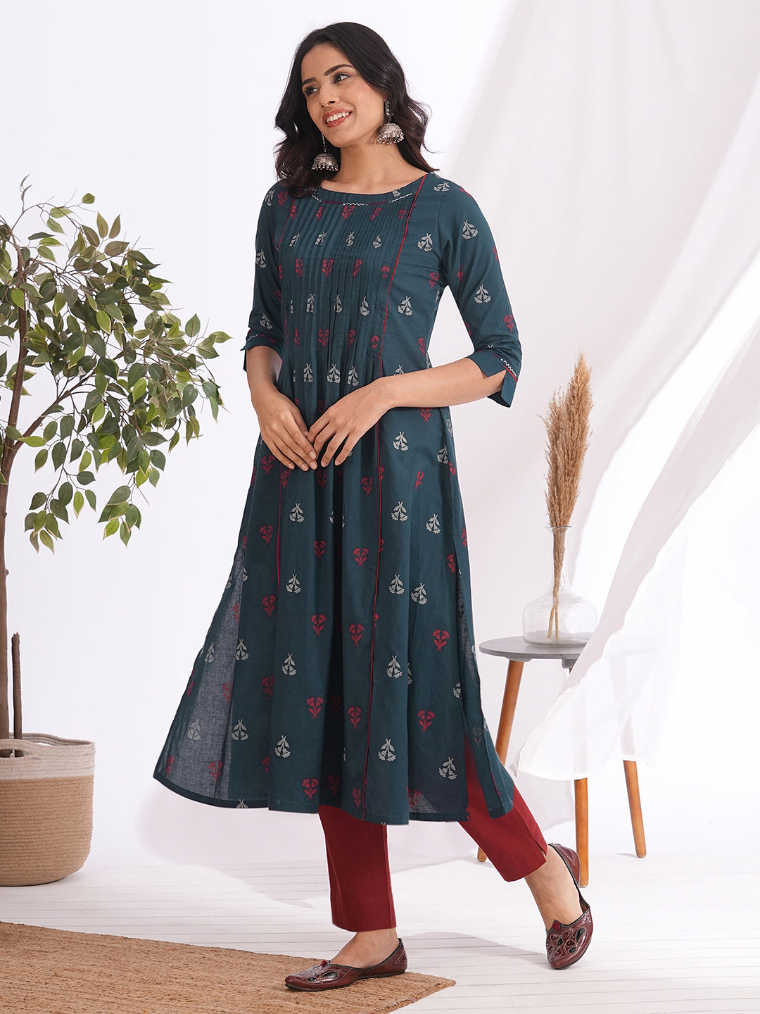 A-line pleated kurta with an printed cotton fabric with hand embroidery and pocket