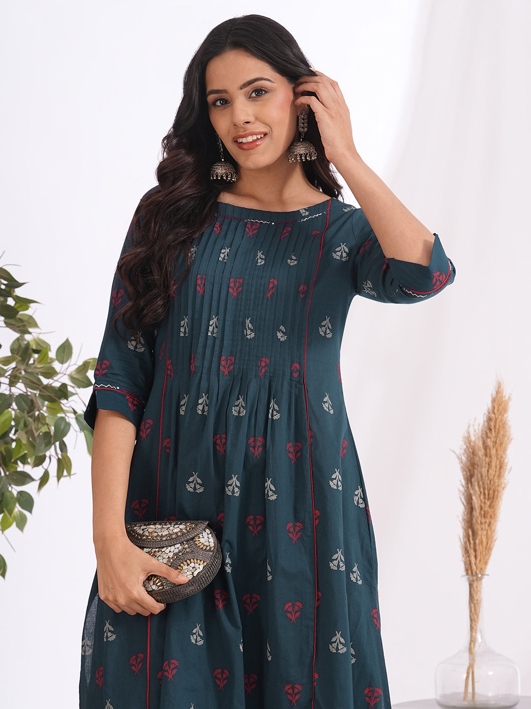 A-line pleated kurta with an printed cotton fabric with hand embroidery and pocket