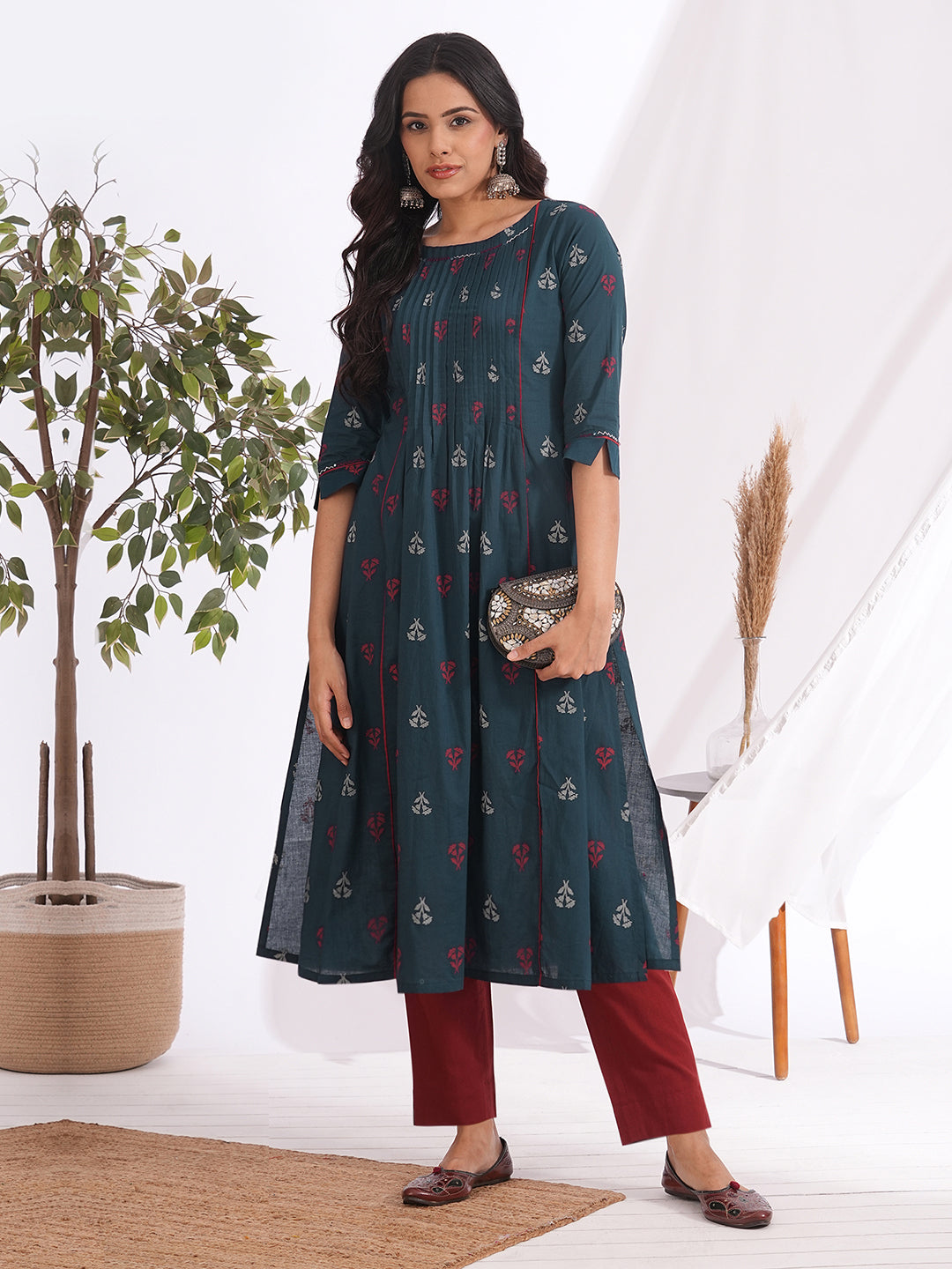 A-line pleated kurta with an printed cotton fabric with hand embroidery and pocket