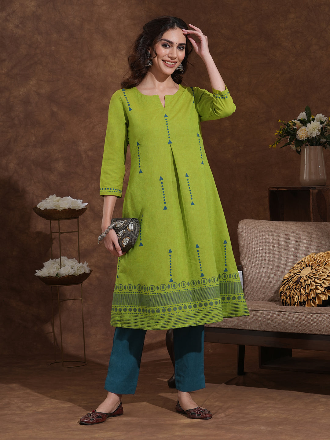 A-line kurta in woven cotton fabric with geometric block print and a side pocket.