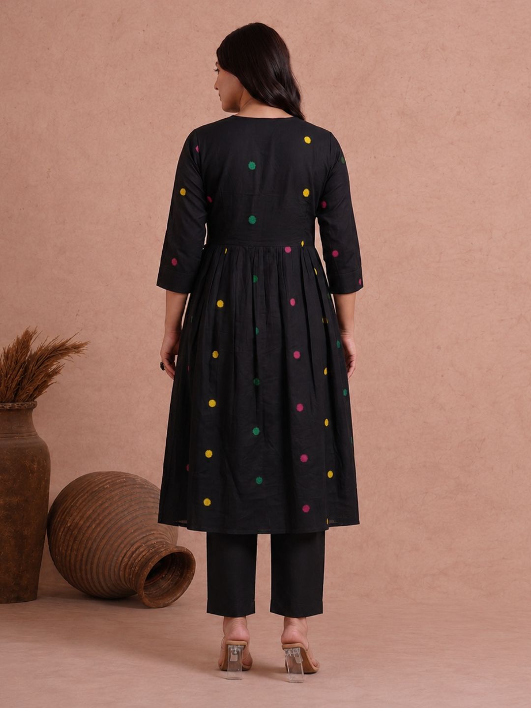 Pocketed and A-line Fit and Flare Angrakha style Dobby kurta with handwork, tassels and gathering.