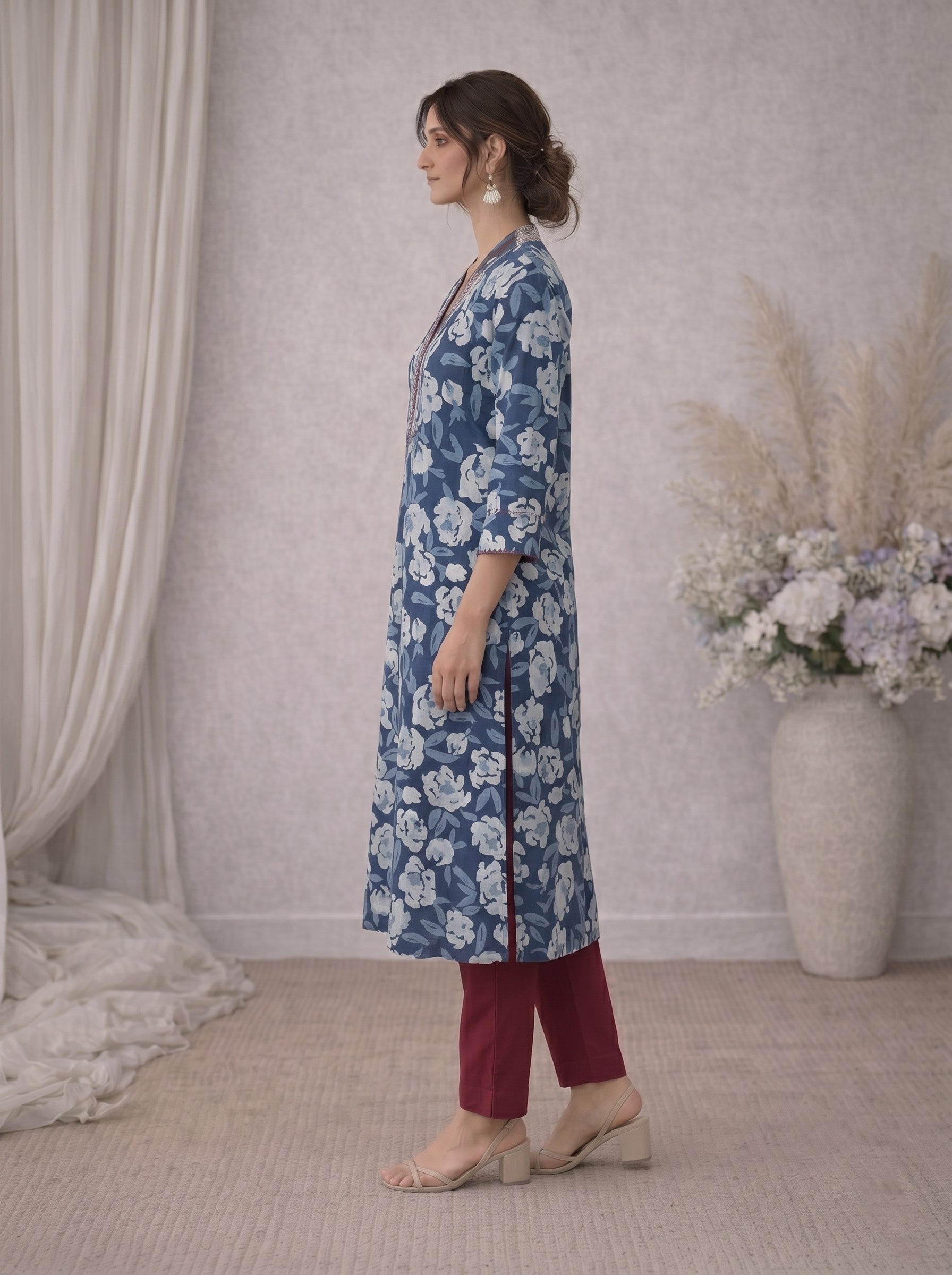 Pocketed A-line kurta in cotton dhabu print with hand embroidery detailing.
