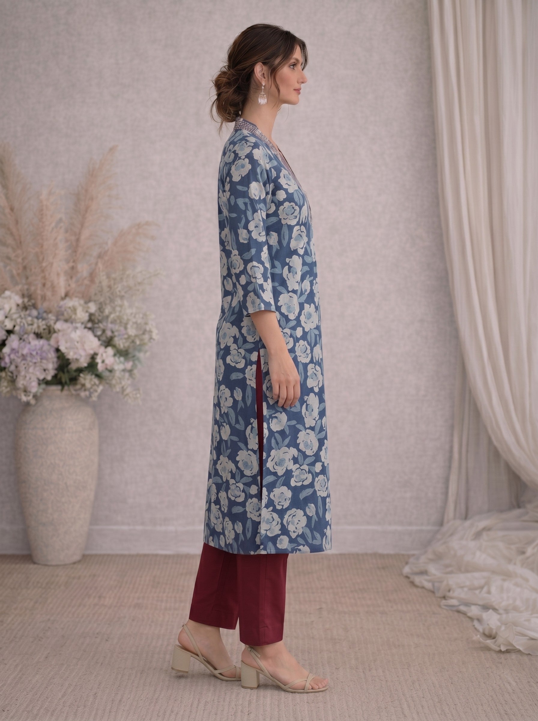 Pocketed A-line kurta in cotton dhabu print with hand embroidery detailing.