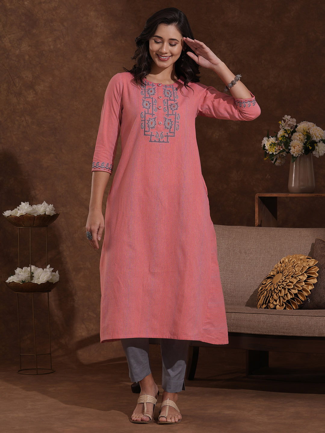 A-line kurta in woven cotton fabric with thread embroidery and in seam pockets.