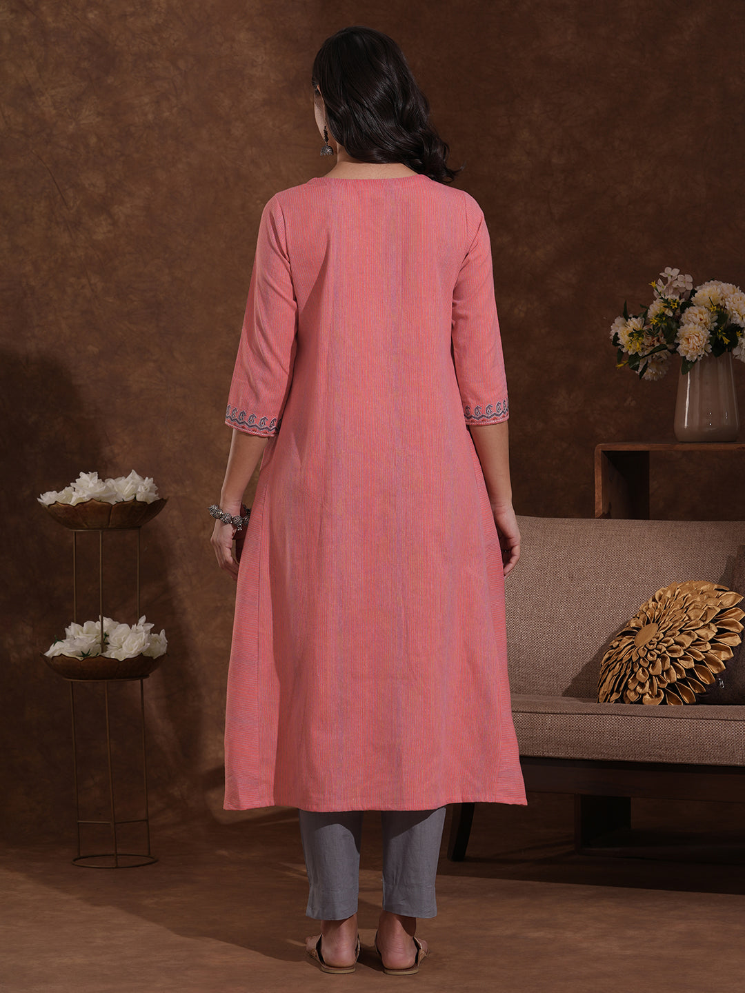 A-line kurta in woven cotton fabric with thread embroidery and in seam pockets.