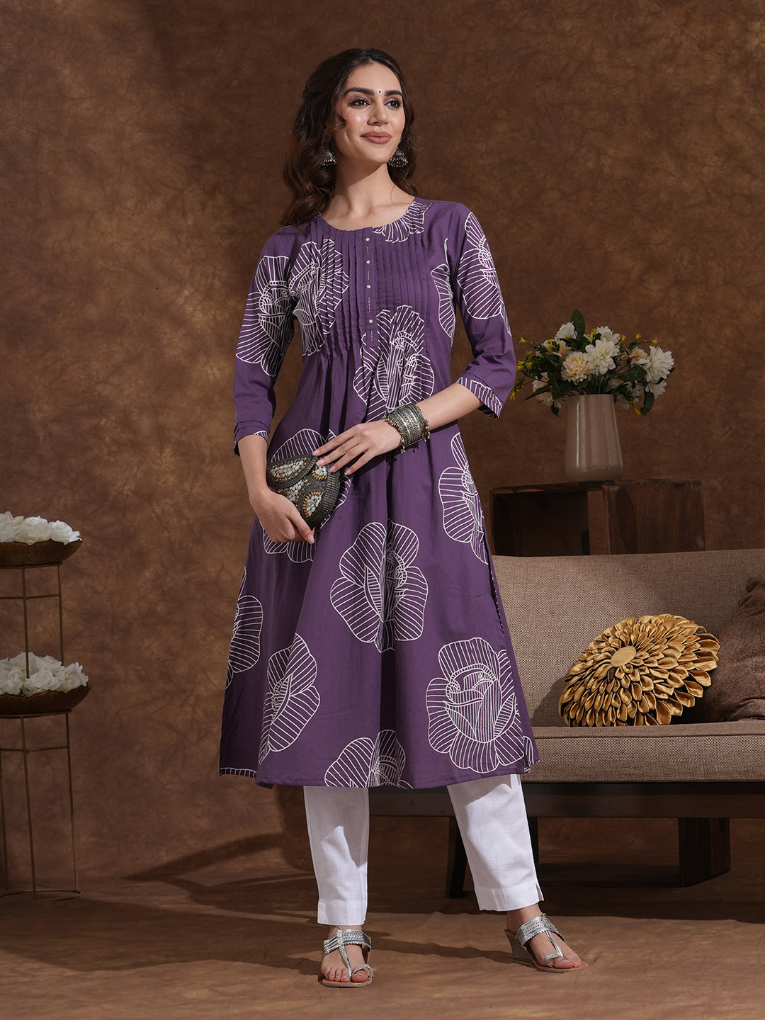Pleated matte purple kurta in bold floral print in an A line fit with handwork and pocket.