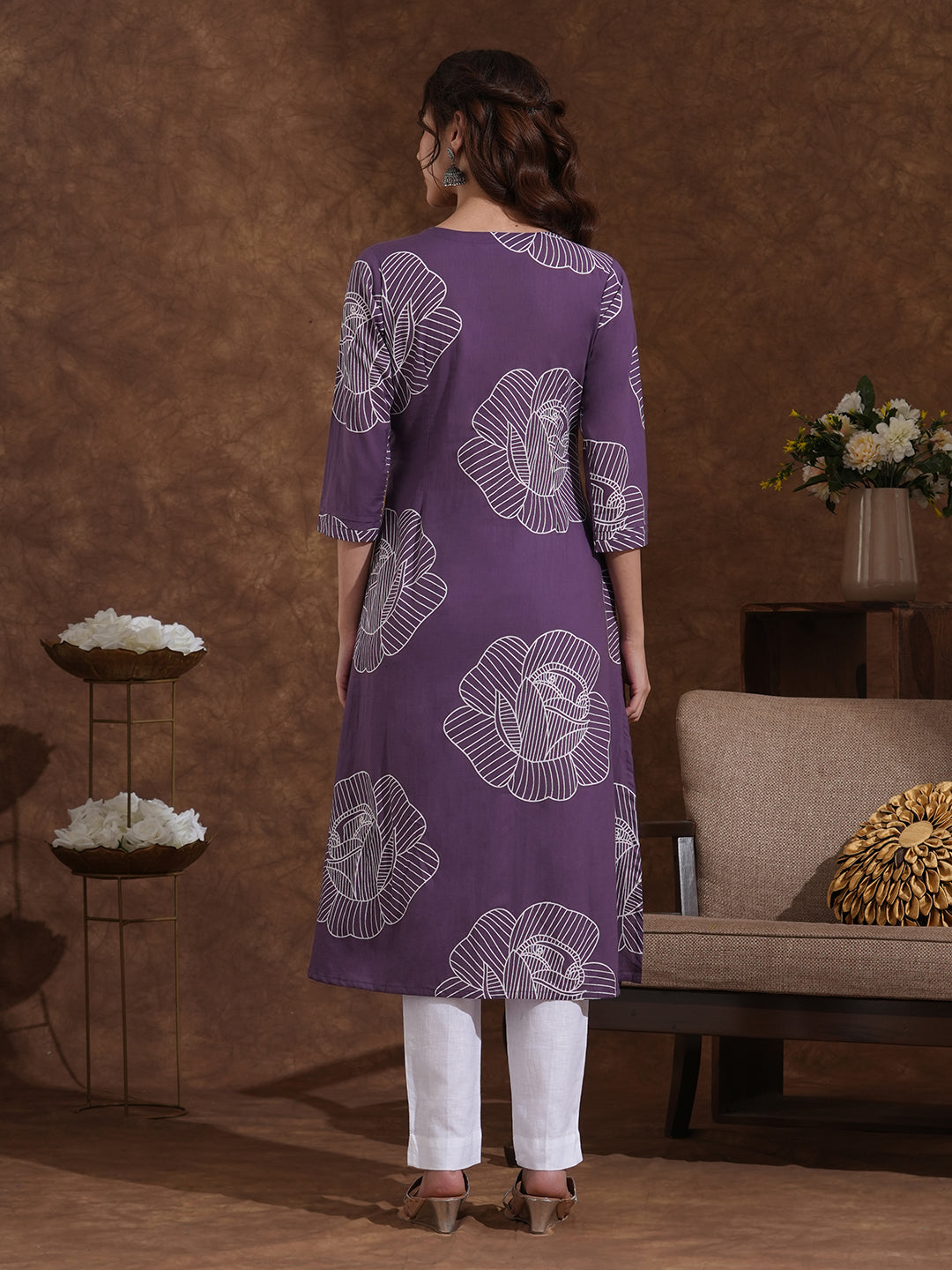 Pleated matte purple kurta in bold floral print in an A line fit with handwork and pocket.