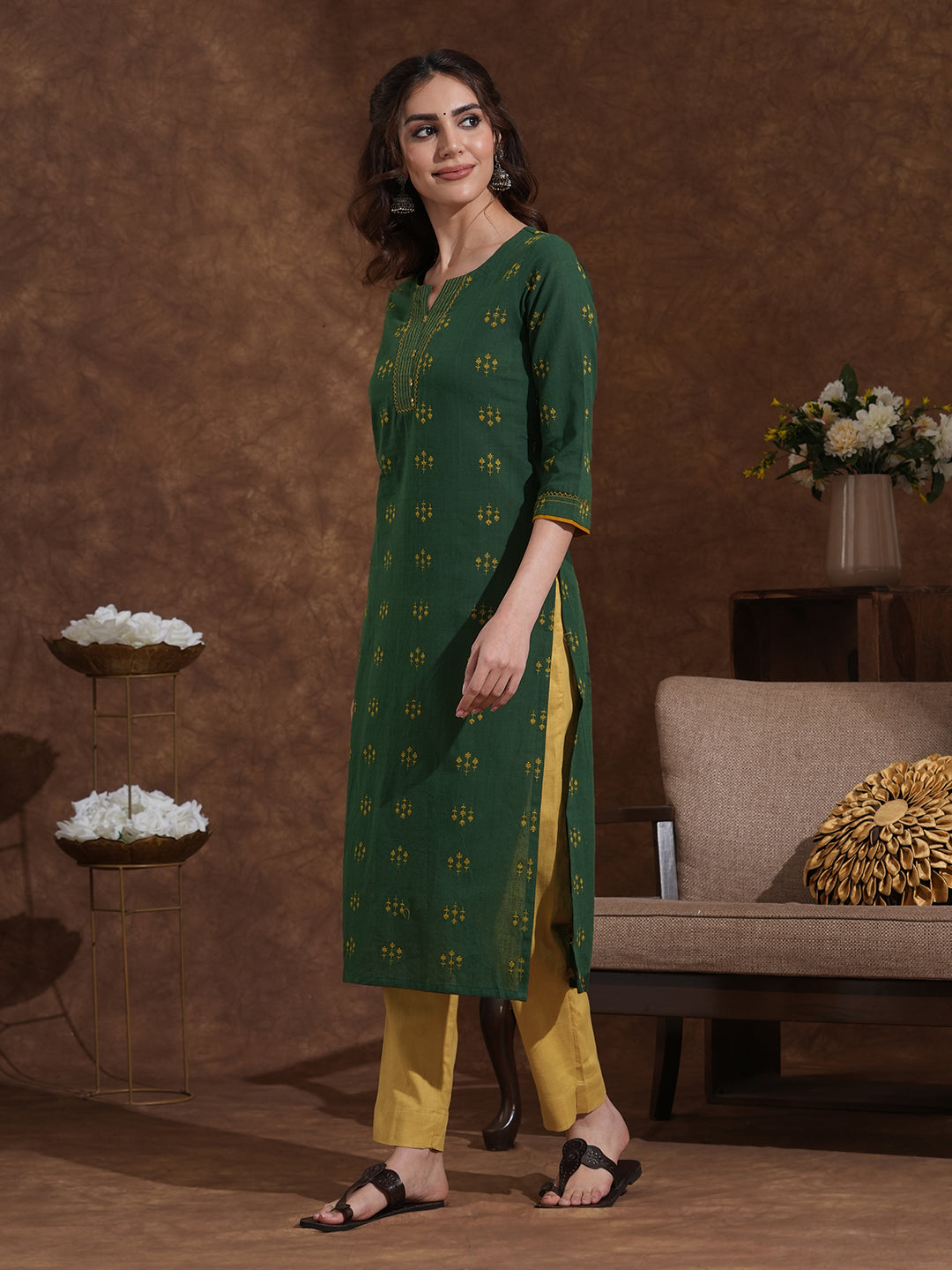 Straight fit cotton dobby kurta with hand embroidery and mirror work.