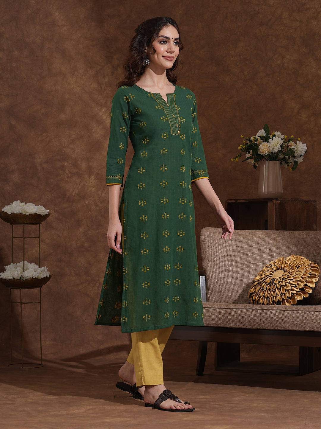 Straight fit cotton dobby kurta with hand embroidery and mirror work.