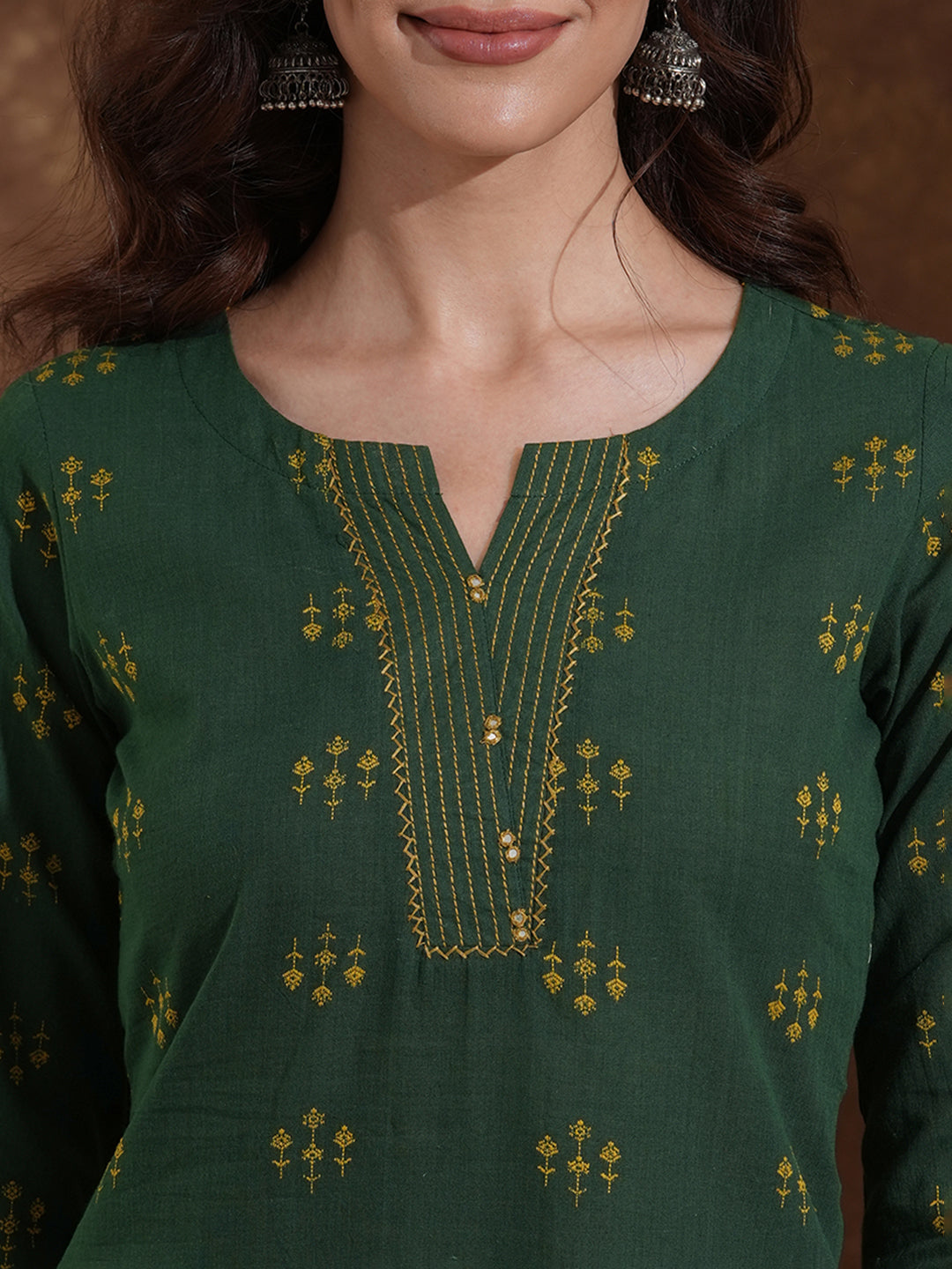 Straight fit cotton dobby kurta with hand embroidery and mirror work.