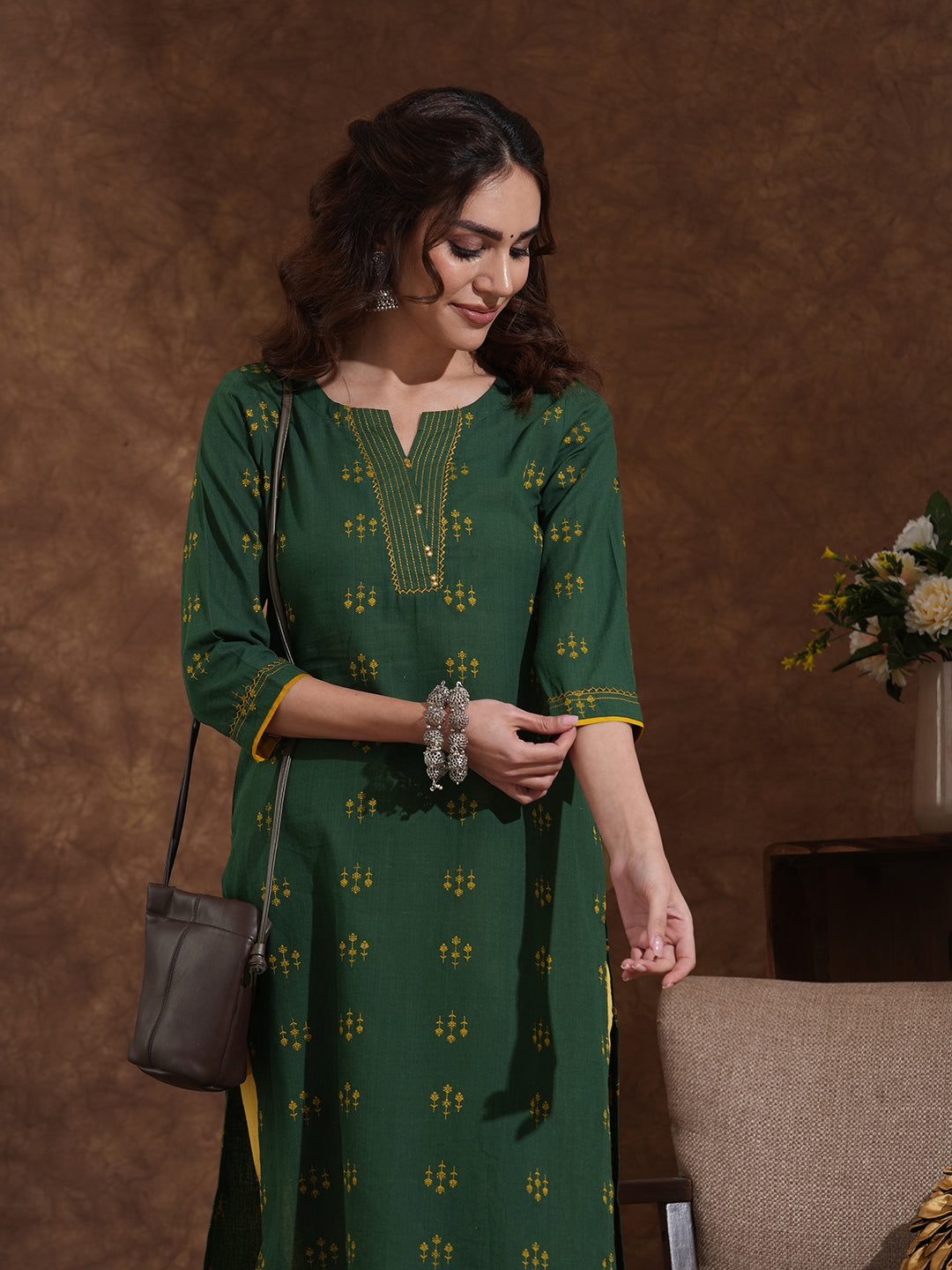 Straight fit cotton dobby kurta with hand embroidery and mirror work.