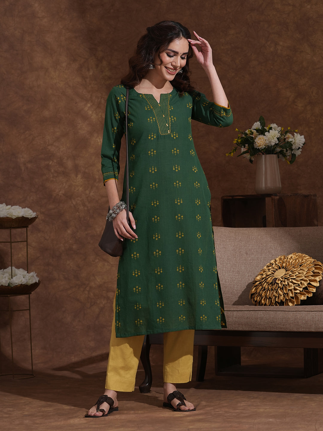 Straight fit cotton dobby kurta with hand embroidery and mirror work.