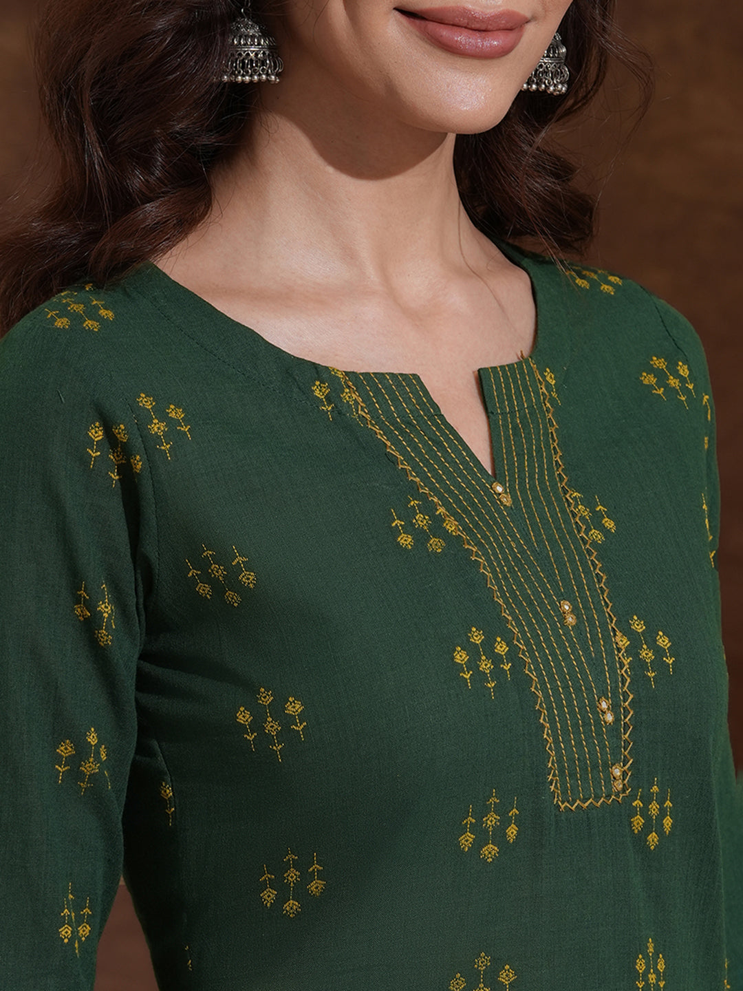 Straight fit cotton dobby kurta with hand embroidery and mirror work.