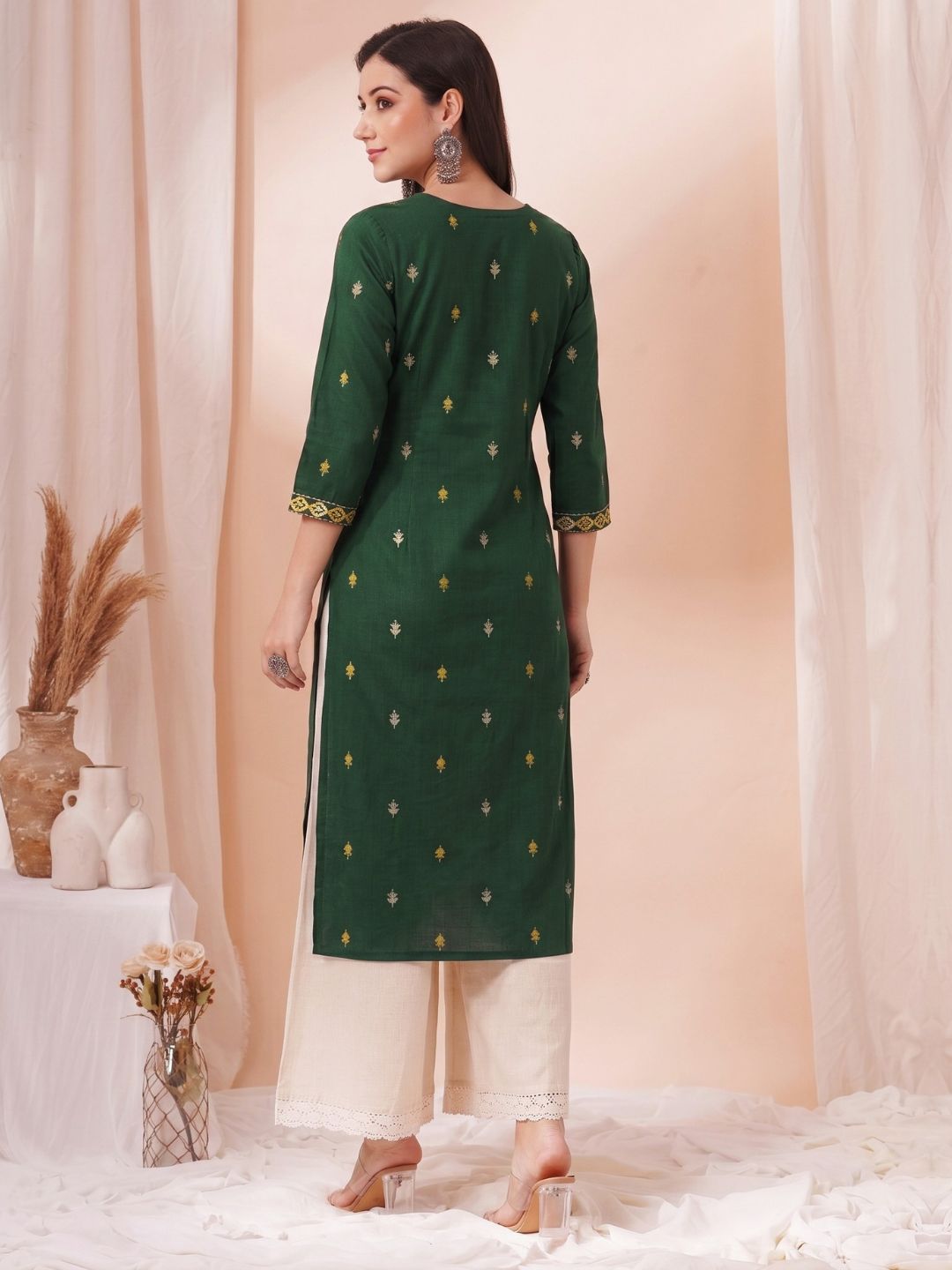 Women Green Straight Fit Cotton Woven Kurta with Embroidered Neckline & Sleeves.