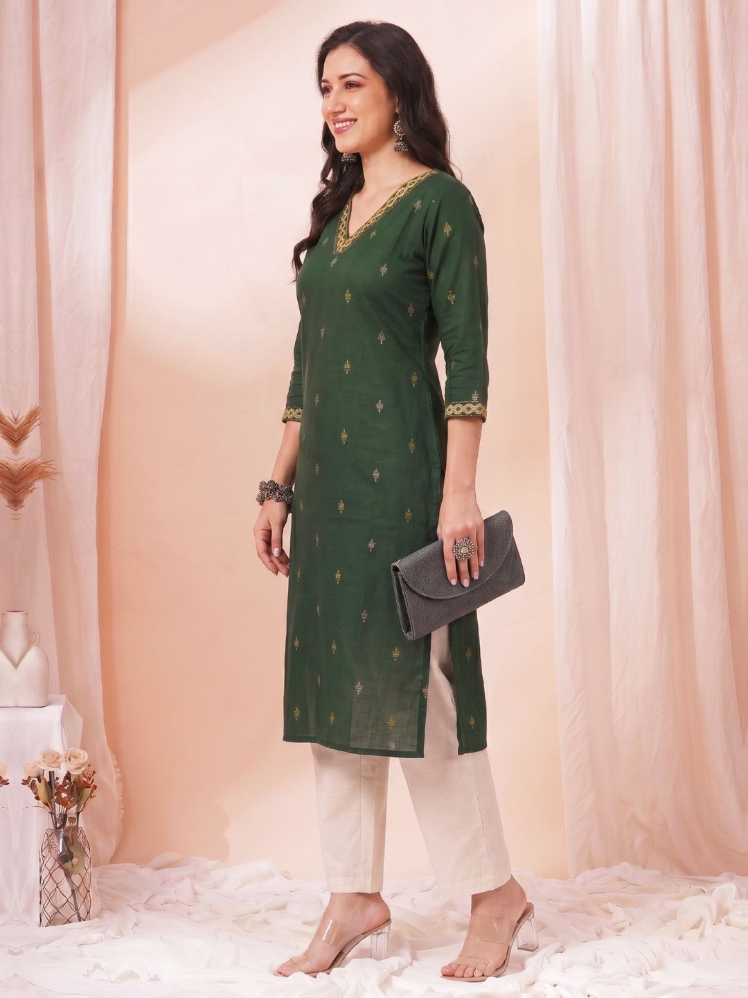 Women Green Straight Fit Cotton Woven Kurta with Embroidered Neckline & Sleeves.