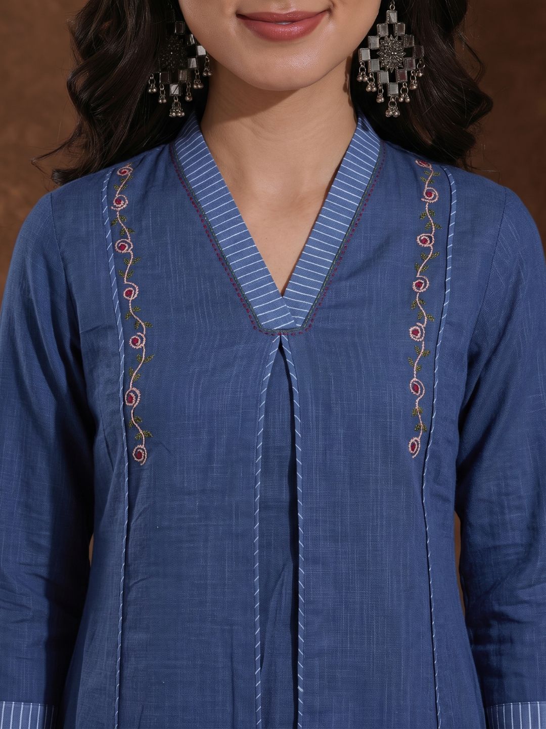 A-Line Cotton Kurta with Elegance Floral Embroidered Yoke and Contrast Piping Detailing.