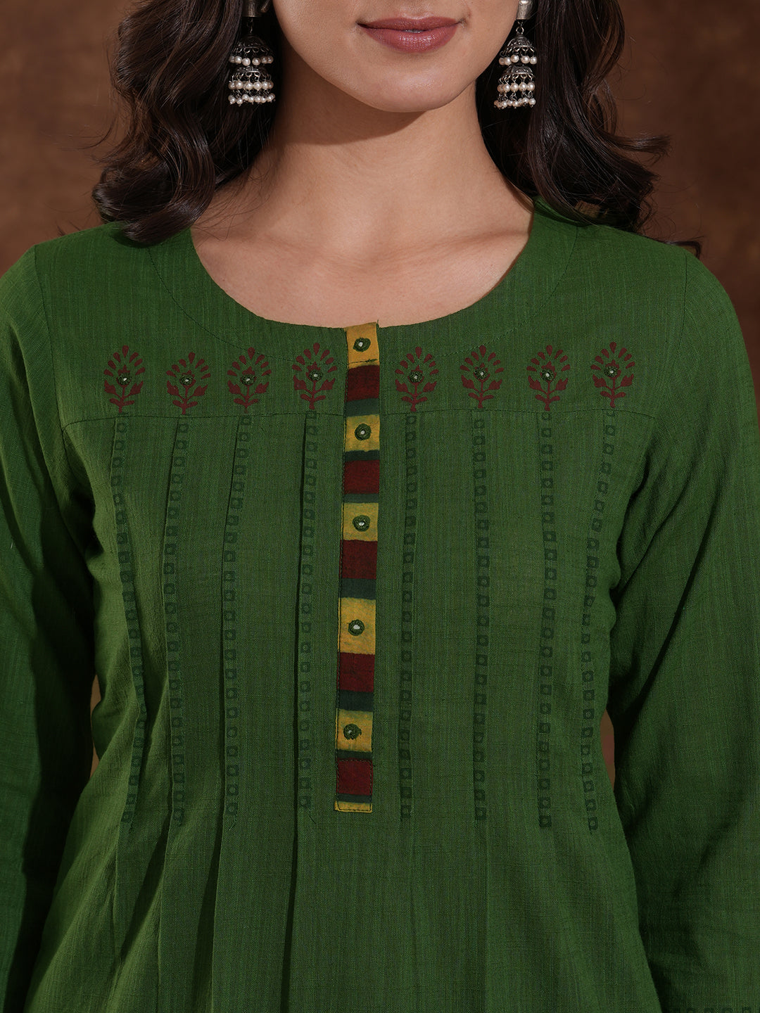 Straight fit kurta with block printed shoulder yoke and tucks in the front with ajarakh trim fabric.