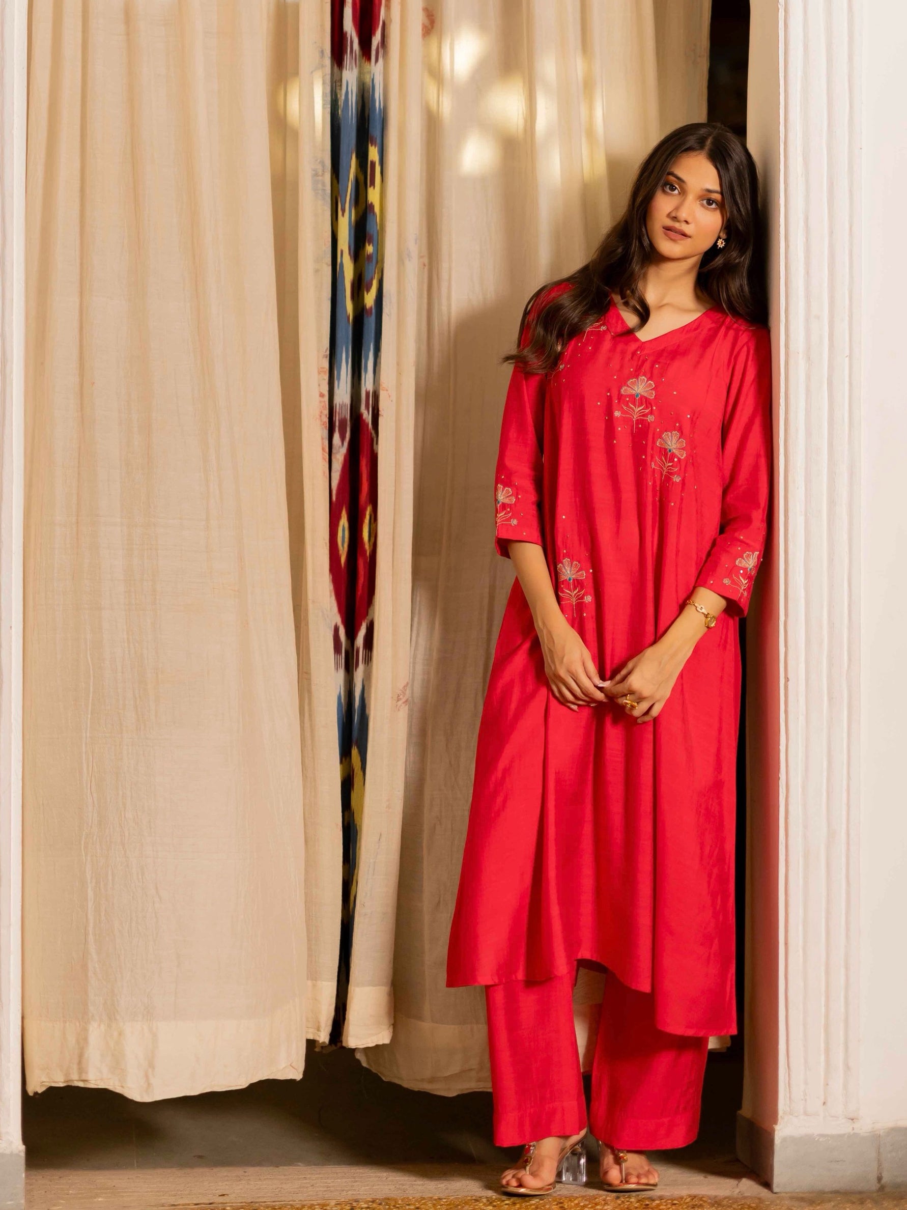 Party Edit- A tent fit kurta with placement embroidery and handwork sequence on the front and sleeves.