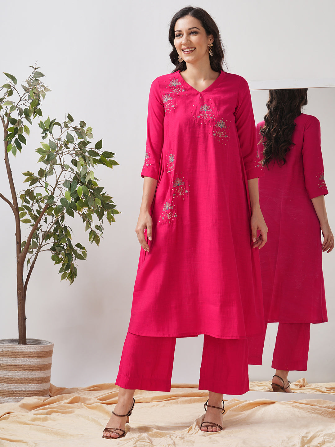 Party Edit- A tent fit kurta with placement embroidery and handwork sequence on the front and sleeves.