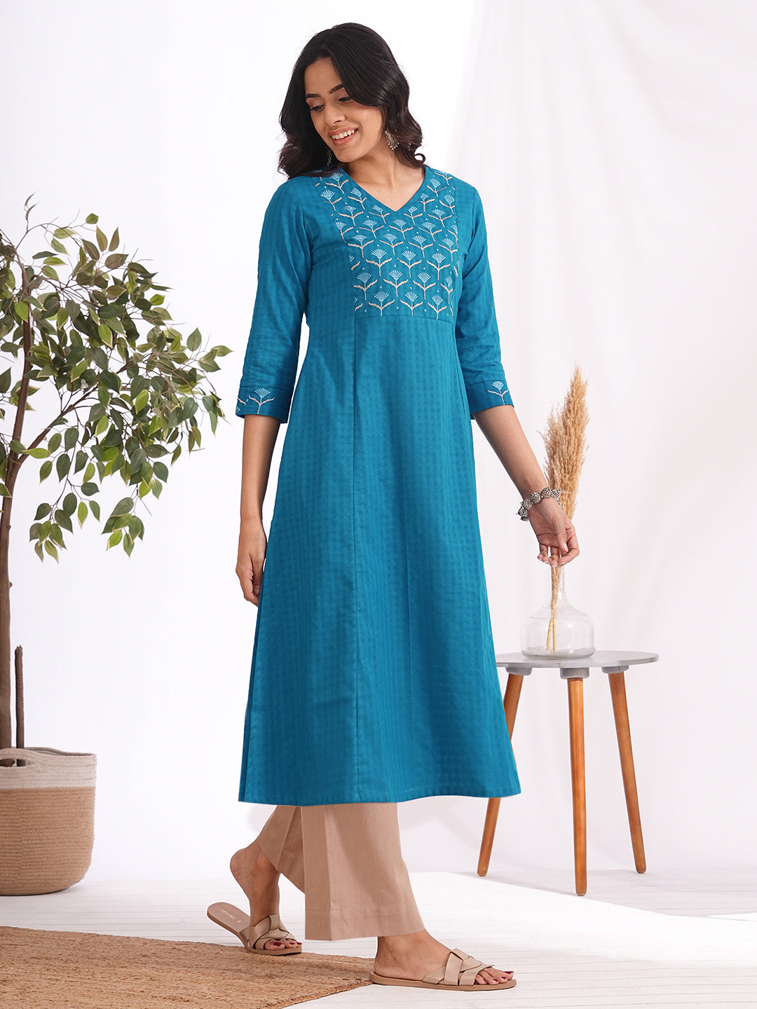 Woven checks fabric A-line kurta with embroidered yoke and cuff