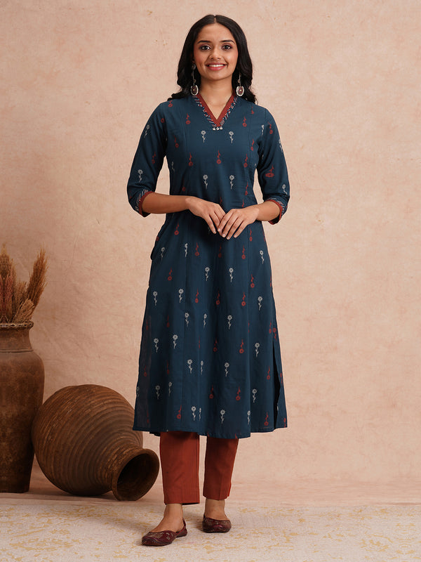 Printed A-line kurta with contrast fabric detailing with mirror work.