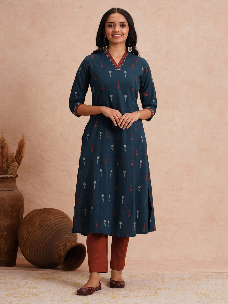 Printed A-line kurta with contrast fabric detailing with mirror work.