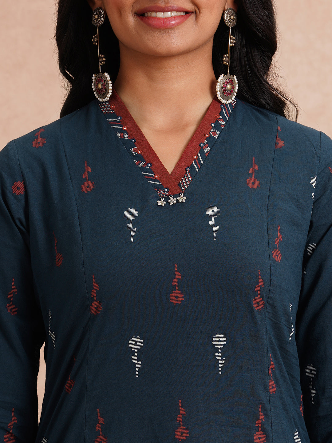 Printed A-line kurta with contrast fabric detailing with mirror work.